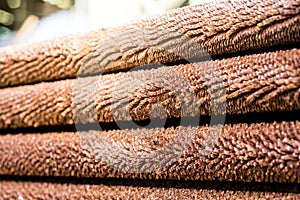 Steel fin tubes of the heat exchanger, the water heater in the boiler as background with warm light