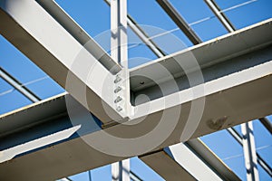 Steel frame of new building in construction - girder joint detail - shallow depth of field