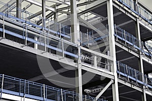 Steel framed building under construction with blue railings