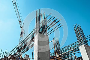 Steel Frames of A Building Under Construction, With Tower Crane On Top