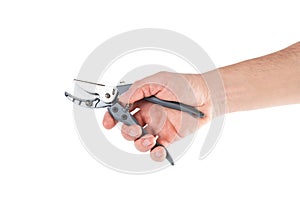 Steel garden secateurs, scissors with gray plastic handle in male's hand isolated on a white background