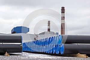 Steel gas pipes in stack on open storage at an factory