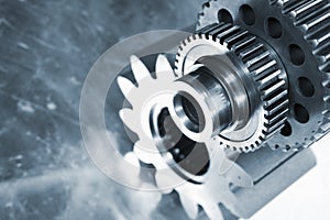 Steel gears against titanium background