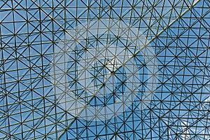 Steel and Glass Atrium Roof Under Blue Sky