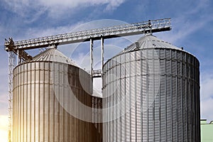 Steel grain storage silos with a conical bottom can be used for various purposes photo