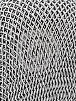 Steel grille background. Close-up shot of microphone , Selective focus