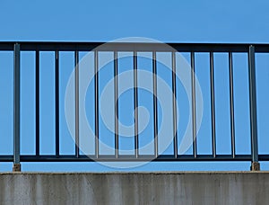 Steel guard rail with pickets and posts on highway with blue sky photo