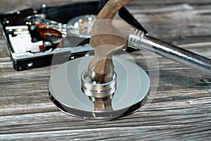 A steel hammer on HDD platters and spindle motor, hard disk drive disassembled damaged components, computer maintenance, recovery