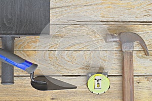 Steel hammer, wooden handle, meter tape.Brick wall tools Build a house wall Construction of new houses,