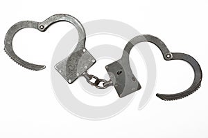 Steel handcuffs isolated on a white background