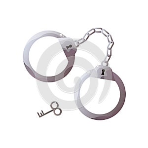 Steel handcuffs with key isolated on white background