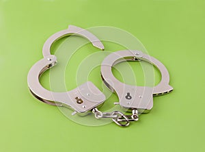 Steel handcuffs on a white background