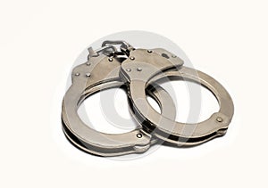 Steel handcuffs on a white background