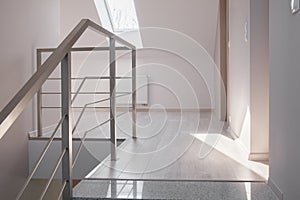 Steel handrail and marble stairs photo