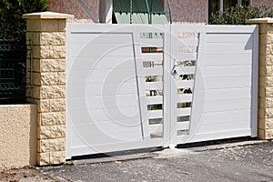Steel high white metal gate fence on design modern suburb house street