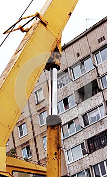 steel hydraulic piston to crane, which lifts and lowers the concrete slab during repair work.