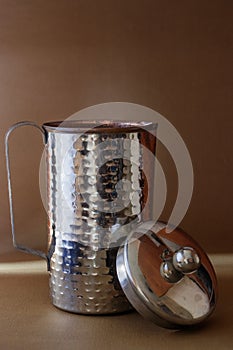 A steel Jar for pouring water.