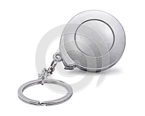 Steel key chain isolated on white background. Blank keyring in measuring tape concept. Clipping path