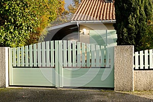 Steel large green clear metal gate fence on modern house