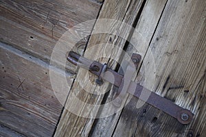 Steel lock on the door of an old barn