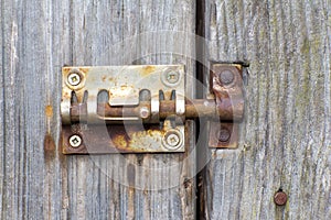 Steel lock of iron corroded by rust. Very old. Strong influence