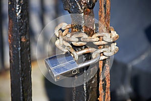 Steel lock on rusted gate