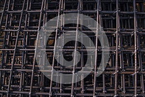 Steel mesh for reinforcement concrete in construction site, closeup of photo