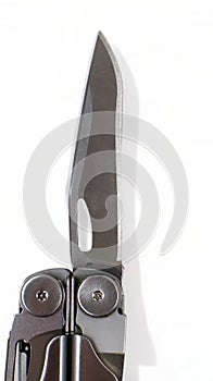A steel multi-tool with an open knife blade lies on a white background. Pocket open folding knife. Portable multitasking