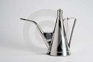 Steel oil cruet on white background