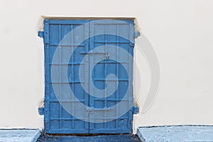 Steel old blue door on a background