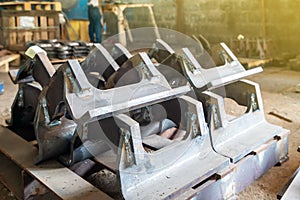 Steel parts after assembly by welding for industrial place on wood palette at factory