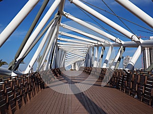 Steel pedestrian bridge over a busy street