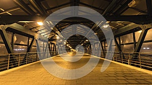 Steel pedestrian bridge overpasses highway