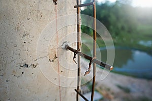 The steel is permanently bonded to the cement with epoxy glue. Steel plug epoxy glue. photo