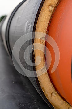 Steel pipe with heat insulation on construction site close up