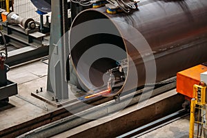 Steel pipe internal seam welding by longitudinal tack welding machine photo
