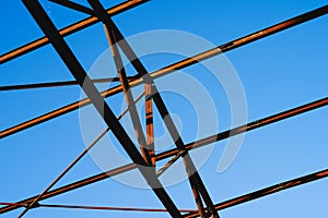 Steel pipe structure under a clear blue sky