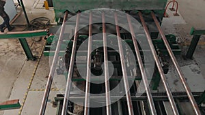 Steel pipes production, pipe transported on production line, heavy industry, rolled metal factory. Manufacture and production conc