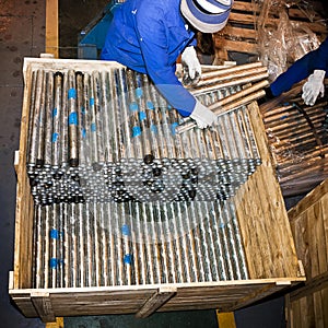 Steel Pipes Stacked into Wooden Crates