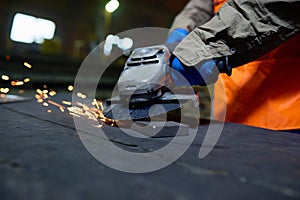 Steel Plant Worker Using Angle Grinder