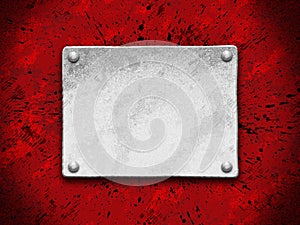 Steel plate on a red grunge background