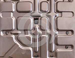 The steel plate is shaped by stamping.