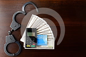 Steel police handcuffs, dollars money, payment device and bank c