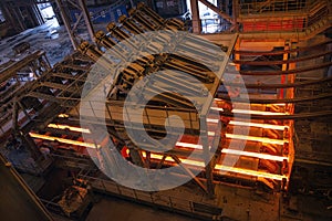 Steel production in electric furnaces. Sparks of molten steel. Electric arc furnace shop .