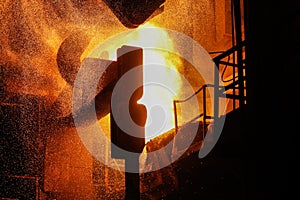 Steel production in electric furnaces. Sparks of molten steel. Electric arc furnace shop EAF. Metallurgical production, heavy