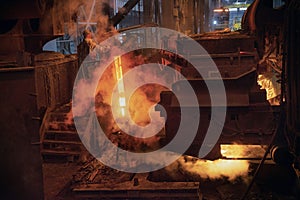 Steel production in electric furnaces. Sparks of molten steel. Electric arc furnace shop . Metallurgical production, heavy