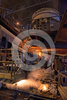 Steel production in electric furnaces. Sparks of molten steel. Electric arc furnace shop . Metallurgical production, heavy