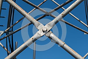 Steel pylon details, reticular structure of a repeater antenna for radio, telephone and communications bands. photo