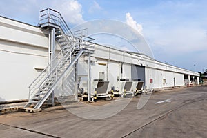 Steel railing roof stairs. Metal staircase to the roof of a modern building. Stairwell fire or emergency exit on wall of building