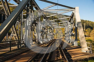 Steel railroad bridge close up on a bright autumn day